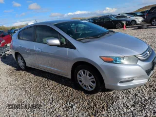 2010 Honda Insight LX with VIN JHMZE2H51AS011243, listed as a Copart auction lot 54445555 with 224,722 mi miles and Salvage Title. Bid and sale history available at DreamBid. Image 4.