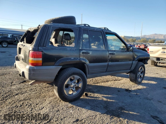 1998 Jeep Grand Cherokee Laredo with VIN 1J4FX58S4WC102623, listed as a Copart auction lot 86188764 with 283,210 mi miles and Salvage Title. Bid and sale history available at carsss.com. Image 3.