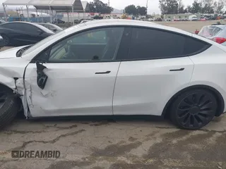 2022 Tesla Model Y Performance with VIN 7SAYGDEF0NF400560, listed as a IAAI auction lot 41783912 with 36,513 mi miles and . Bid and sale history available at DreamBid. Image 14.