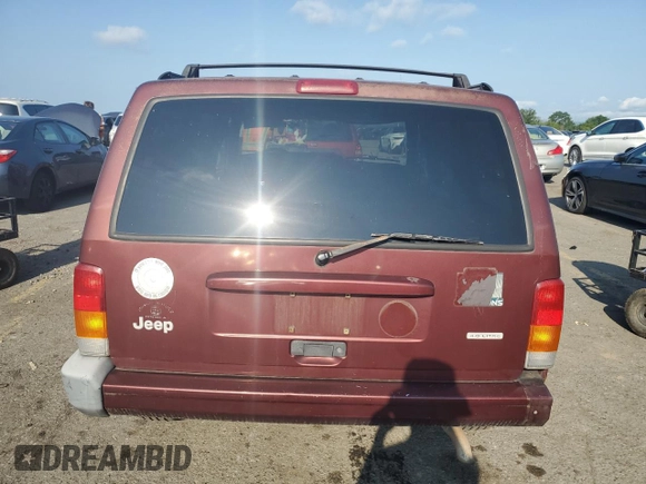 2000 Jeep Cherokee z VIN 1J4FF48S2YL135037, wystawiony jako Copart lot #66156505 z przebiegiem 72 433 mil mil oraz Szkoda całkowita • Salvage title. Historia ofert i sprzedaży dostępna na DreamBid. Obrazek 6.