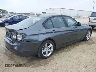 2014 BMW 3 Series 328d xDrive with VIN WBA3D5C59EKX96701, listed as a IAAI auction lot 40716972 with 163,775 mi miles. Bid and sale history available at carsss.com. Image 4.