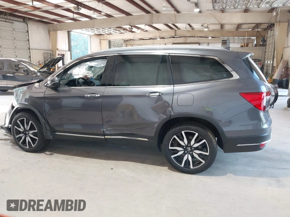 2021 Honda Pilot Touring 8-Passenger with VIN 5FNYF6H95MB048527, listed as a IAAI auction lot 42542138 with 40,584 mi miles and . Bid and sale history available at DreamBid. Image 14.