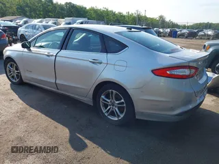 2016 Ford Fusion SE Hybrid z VIN 3FA6P0LU6GR121605, wystawiony jako IAAI lot #42651096 z przebiegiem 194 693 mil mil oraz . Historia ofert i sprzedaży dostępna na DreamBid. Obrazek 3.