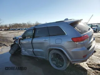 2014 Jeep Grand Cherokee Overland with VIN 1C4RJFCG2EC281062, listed as a Copart auction lot 47099225 with 127,660 mi miles and Salvage Title. Bid and sale history available at carsss.com. Image 2.