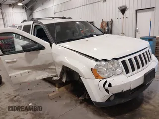 2010 Jeep Grand Cherokee Laredo with VIN 1J4PR4GK7AC126059, listed as a IAAI auction lot 41599058 with 154,192 mi miles. Bid and sale history available at carsss.com. Image 1.