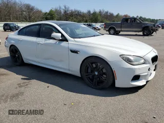 2015 BMW M6 z VIN WBS6C9C5XFD467711, wystawiony jako Copart lot #66574644 z przebiegiem 101 001 mil mil oraz Szkody całkowita. Historia ofert i sprzedaży dostępna na DreamBid. Obrazek 4.