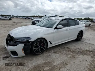 2023 BMW 5 Series M550i xDrive with VIN WBA13BK08PCM88799, listed as a Copart auction lot 46651095 with 9,861 mi miles and Salvage title. Bid and sale history available at DreamBid. Image 1.