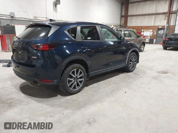 2018 Mazda CX-5 Touring with VIN JM3KFBCM5J0434716, listed as a IAAI auction lot 41738956 with 108,264 mi miles and . Bid and sale history available at DreamBid. Image 4.