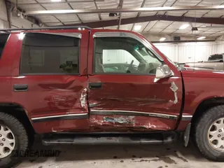 1999 GMC Yukon with VIN 1GKEK13R3XJ700930, listed as a IAAI auction lot 40915481 with 249,773 mi miles. Bid and sale history available at carsss.com. Image 13.