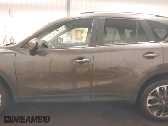 2016 Mazda CX-5 Grand Touring with VIN JM3KE4DY0G0732843, listed as a IAAI auction lot 41520889 with 149,798 mi miles. Bid and sale history available at carsss.com. Image 14.