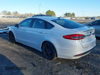 2018 Ford Fusion SE z VIN 3FA6P0H77JR108212, wystawiony jako IAAI lot #41208435 z przebiegiem 68 825 mil mil oraz . Historia ofert i sprzedaży dostępna na DreamBid. Obrazek 3.