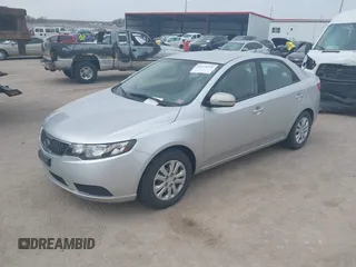 2012 Kia Forte EX with VIN KNAFU4A25C5591601, listed as a IAAI auction lot 42071351 with 120,636 mi miles. Bid and sale history available at carsss.com. Image 2.