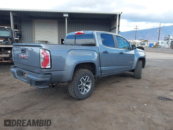 2021 GMC Canyon 4WD AT4 z VIN 1GTG6FEN8M1275345, wystawiony jako IAAI lot #42045878 z przebiegiem 68 299 mil mil oraz . Historia ofert i sprzedaży dostępna na DreamBid. Obrazek 4.