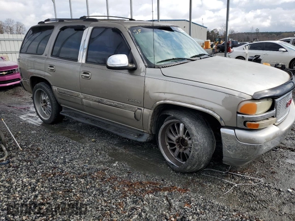 2001 GMC Yukon SLT z VIN 1GKEC13T51J145673, wystawiony jako Copart lot #83568954 z przebiegiem 310 415 mil mil oraz Szkoda całkowita • Salvage title. Historia ofert i sprzedaży dostępna na DreamBid. Obrazek 4.