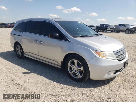 2012 Honda Odyssey Touring with VIN 5FNRL5H94CB009952, listed as a Copart auction lot 54322695 with 135,551 mi miles and Salvage title. Bid and sale history available at DreamBid. Image 4.