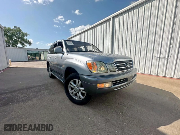 2003 Lexus LX 470 z VIN JTJHT00W933535214, wystawiony jako Copart lot #62037495 z przebiegiem 373 210 mil mil oraz Czysty tytuł • Clean title. Historia ofert i sprzedaży dostępna na DreamBid. Obrazek 1.