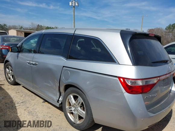 2012 Honda Odyssey Touring with VIN 5FNRL5H92CB108690, listed as a IAAI auction lot 41826580 with 150,327 mi miles and . Bid and sale history available at DreamBid. Image 14.