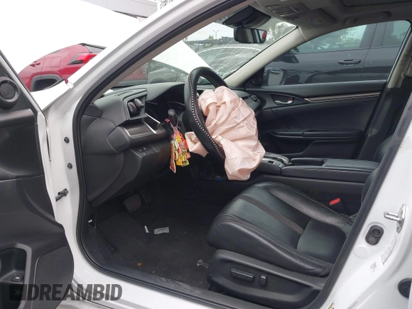 2020 Honda Civic EX-L with VIN 19XFC1F70LE203137, listed as a IAAI auction lot 42028424 with 87,011 mi miles and . Bid and sale history available at DreamBid. Image 18.