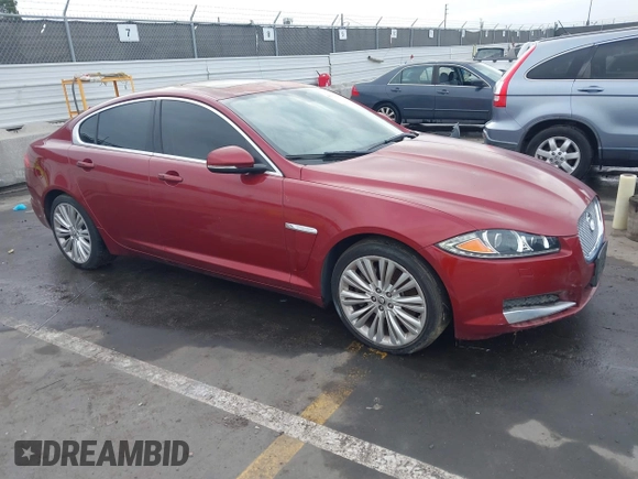2012 Jaguar XF Portfolio with VIN SAJWA0HB5CLS21062, listed as a IAAI auction lot 41733179 with 125,614 mi miles. Bid and sale history available at carsss.com. Image 1.