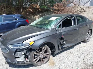 2019 Ford Fusion Titanium with VIN 3FA6P0D93KR124299, listed as a IAAI auction lot 40182478 with 73,408 mi miles. Bid and sale history available at carsss.com. Image 6.