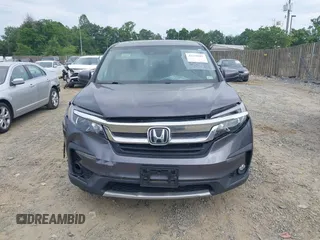 2019 Honda Pilot EX-L with VIN 5FNYF5H45KB018293, listed as a IAAI auction lot 42318481 with 76,617 mi miles and . Bid and sale history available at DreamBid. Image 12.