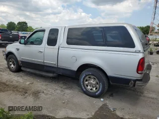 1999 Ford F-250 with VIN 1FTRX27LXXNC18863, listed as a Copart auction lot 63051395 with 118,695 mi miles and Clean title. Bid and sale history available at DreamBid. Image 2.