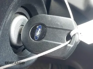 2014 Ford Escape SE z VIN 1FMCU9GX1EUD66666, wystawiony jako IAAI lot #42571222 z przebiegiem Nie podano mil oraz . Historia ofert i sprzedaży dostępna na DreamBid. Obrazek 11.
