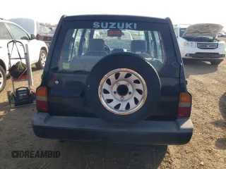 1998 Suzuki Sidekick JS z VIN 2S3TE02V1W6402490, wystawiony jako Copart lot #78316244 z przebiegiem 79 724 mil mil oraz Tytuł czysty. Historia ofert i sprzedaży dostępna na DreamBid. Obrazek 6.