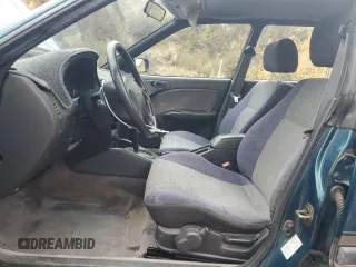 1996 Subaru Legacy Outback with VIN 4S3BG685XT7984194, listed as a Copart auction lot 77999224 with 130,804 mi miles and Salvage title. Bid and sale history available at DreamBid. Image 7.