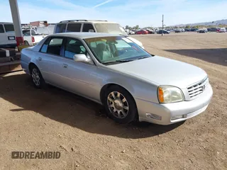2003 Cadillac DeVille DTS z VIN 1G6KF57923U260229, wystawiony jako IAAI lot #41415468 z przebiegiem 58 012 mil mil oraz . Historia ofert i sprzedaży dostępna na DreamBid. Obrazek 1.