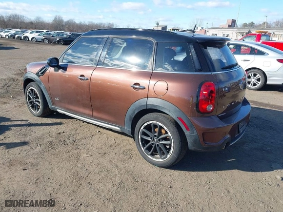 2015 MINI Cooper Countryman S with VIN WMWZC5C55FWP47826, listed as a IAAI auction lot 41342674 with 94,683 mi miles. Bid and sale history available at carsss.com. Image 3.