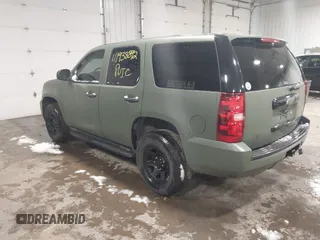 2014 Chevrolet Tahoe Commercial with VIN 1GNSK2E05ER196941, listed as a IAAI auction lot 41938892 with 176,170 mi miles and . Bid and sale history available at DreamBid. Image 3.