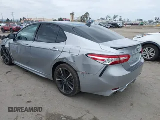 2020 Toyota Camry XSE with VIN 4T1K61AK1LU318098, listed as a IAAI auction lot 42197271 with 64,118 mi miles and . Bid and sale history available at DreamBid. Image 3.