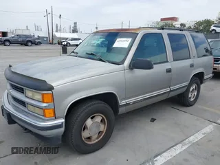 1999 Chevrolet Tahoe Z71 with VIN 1GNEK13R4XJ504675, listed as a IAAI auction lot 42162102 with 320,128 mi miles and . Bid and sale history available at DreamBid. Image 2.