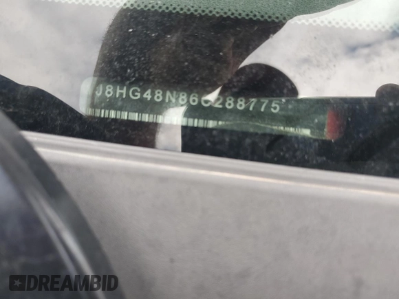 2006 Jeep Commander z VIN 1J8HG48N86C288775, wystawiony jako Copart lot #54603685 z przebiegiem 148 238 mil mil oraz Szkoda całkowita • Salvage title. Historia ofert i sprzedaży dostępna na DreamBid. Obrazek 13.