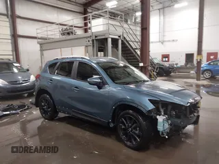 2015 Mazda CX-5 Grand Touring with VIN JM3KE2DY0F0515585, listed as a IAAI auction lot 41678998 with 90,539 mi miles. Bid and sale history available at carsss.com. Image 1.