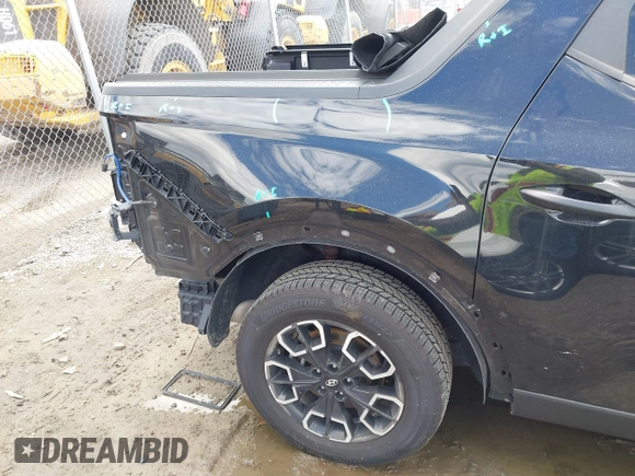 2022 Hyundai Santa Cruz SEL with VIN 5NTJBDAE2NH008015, listed as a IAAI auction lot 42232891 with 31,450 mi miles and . Bid and sale history available at DreamBid. Image 6.