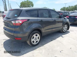 2018 Ford Escape S with VIN 1FMCU0F7XJUA16377, listed as a IAAI auction lot 42080136 with 81,060 mi miles and . Bid and sale history available at carsss.com. Image 4.