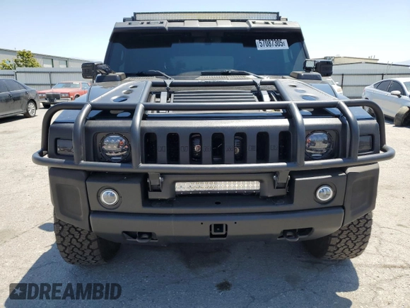 2005 Hummer H2 SUV z VIN 5GRGN23U05H117630, wystawiony jako Copart lot #57087305 z przebiegiem 60 260 mil mil oraz Szkoda całkowita • Salvage title. Historia ofert i sprzedaży dostępna na DreamBid. Obrazek 5.