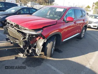 2019 Hyundai Santa Fe SE z VIN 5NMS23AD0KH073670, wystawiony jako IAAI lot #41578398 z przebiegiem 154 716 mil mil oraz . Historia ofert i sprzedaży dostępna na DreamBid. Obrazek 2.