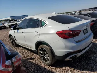 2016 BMW X6 sDrive35i with VIN 5UXKU0C59G0F93163, listed as a Copart auction lot 74148464 with 110,811 mi miles and Salvage Title. Bid and sale history available at carsss.com. Image 2.