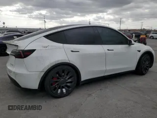 2023 Tesla Model Y Performance z VIN 7SAYGDEFXPF801908, wystawiony jako Copart lot #50737655 z przebiegiem Nie podano mil oraz Szkoda całkowita • Salvage title. Historia ofert i sprzedaży dostępna na DreamBid. Obrazek 3.