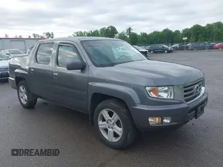 2014 Honda Ridgeline RTL with VIN 5FPYK1F5XEB011772, listed as a IAAI auction lot 42440390 with 145,219 mi miles and . Bid and sale history available at DreamBid. Image 1.