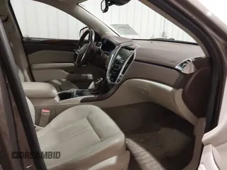 2014 Cadillac SRX Performance Collection z VIN 3GYFNFE38ES578066, wystawiony jako IAAI lot #42153023 z przebiegiem 134 009 mil mil oraz . Historia ofert i sprzedaży dostępna na DreamBid. Obrazek 5.