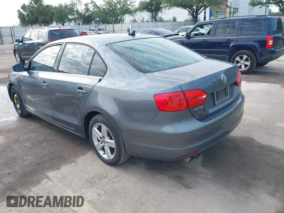 2014 Volkswagen Jetta TDI with VIN 3VWLL7AJ0EM386019, listed as a IAAI auction lot 42229260 with 122,858 mi miles and . Bid and sale history available at DreamBid. Image 3.