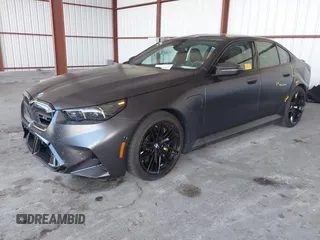 2025 BMW 5 Series with VIN WBS83FK04SCU11874, listed as a IAAI auction lot 42543784 with 4,517 mi miles and . Bid and sale history available at DreamBid. Image 2.