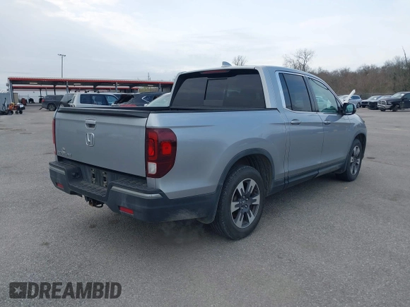 2019 Honda Ridgeline RTL with VIN 5FPYK2F50KB004055, listed as a IAAI auction lot 41576975 with 128,620 mi miles and . Bid and sale history available at DreamBid. Image 4.