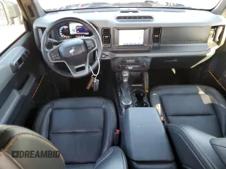 2023 Ford Bronco with VIN 1FMEE5DP0PLC10002, listed as a Copart auction lot 57272555 with 14,035 mi miles and Salvage title. Bid and sale history available at DreamBid. Image 8.