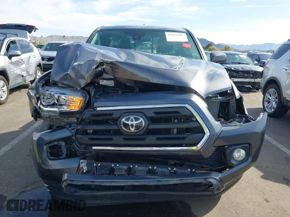 2018 Toyota Tacoma SR with VIN 5TFRX5GN8JX116802, listed as a IAAI auction lot 41879503 with 86,448 mi miles and . Bid and sale history available at DreamBid. Image 6.