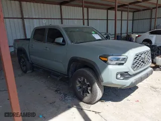 2023 Toyota Tacoma 4WD SR with VIN 3TMCZ5ANXPM613857, listed as a IAAI auction lot 41771957 with 76,232 mi miles. Bid and sale history available at carsss.com. Image 1.